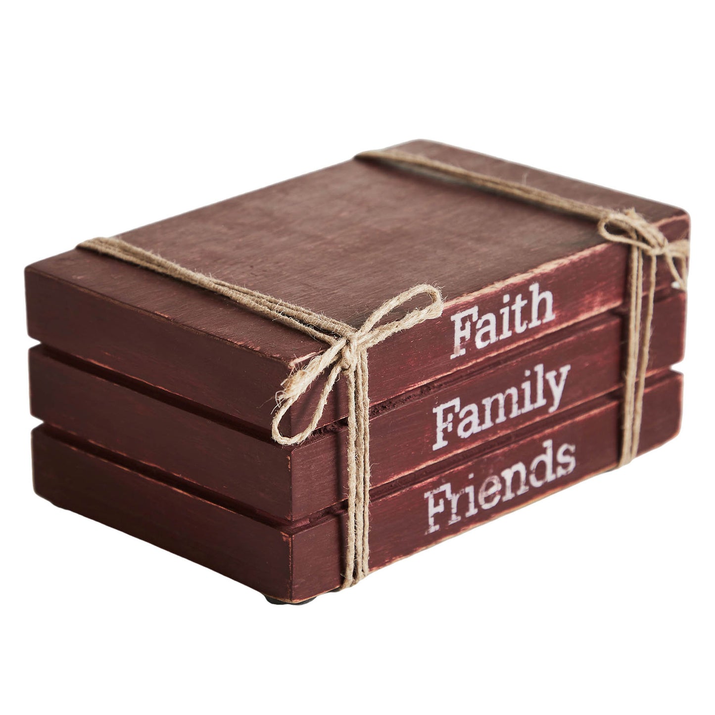 Stack of wooden blocks with 'Faith', 'Family', 'Friends' text tied with twine on a white background