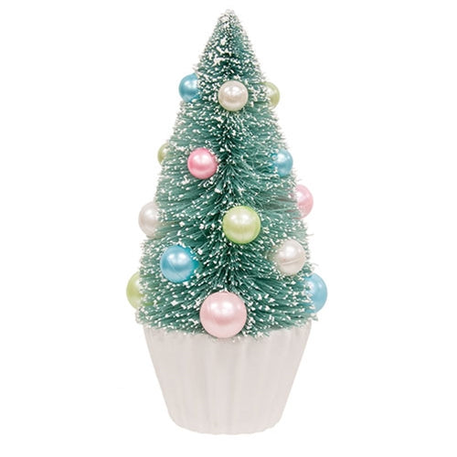 Teal bottle brush tree with faux snow, pastel pearl baubles in blue, pink, green, white on a pleated white base.