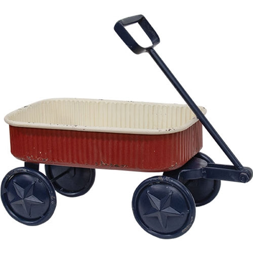 Rustic distressed metal wagon in deep red, cream, and navy with star accents, perfect for farmhouse Americana decor.