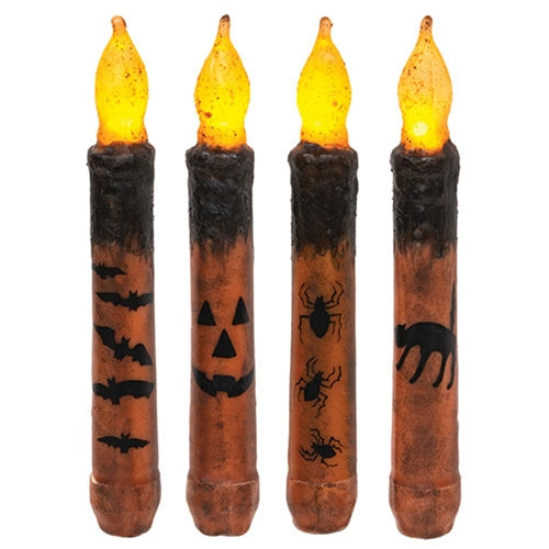 Grungy Halloween flameless taper candles in orange and black with bats, jack-o-lantern, spiders, and cat designs