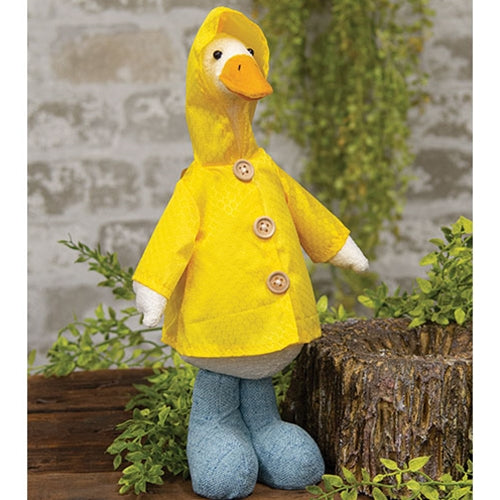 Standing duck decor in a yellow raincoat with blue boots, white plush body, and wooden button details