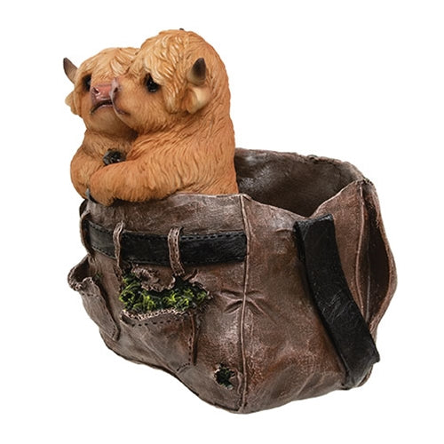 Resin planter shaped like brown pants with two cute Highland cows peeking out, featuring textured details and rustic charm.