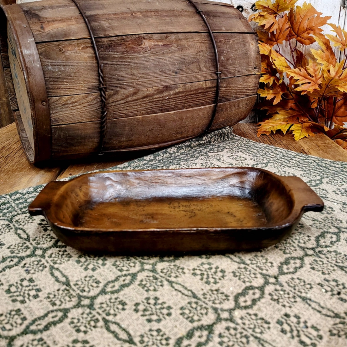 Dark wood farmhouse dough bowl with hand-carved look, rectangular shape, and decorative side handles