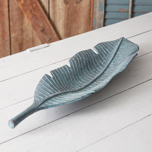 Verdigris Leaf Dish with vibrant colors, crafted from durable cast iron, perfect as an eye-catching centerpiece on a table.