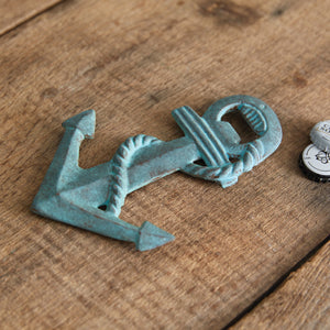 Verdigris anchor-shaped bottle opener made of cast iron, perfect for beer or soda lovers, shown against a neutral background.
