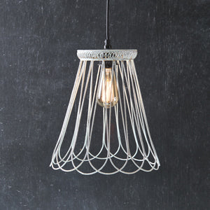 Rustic white bell-shaped pendant light with a classic silhouette, perfect for adding elegance and warmth to any room.