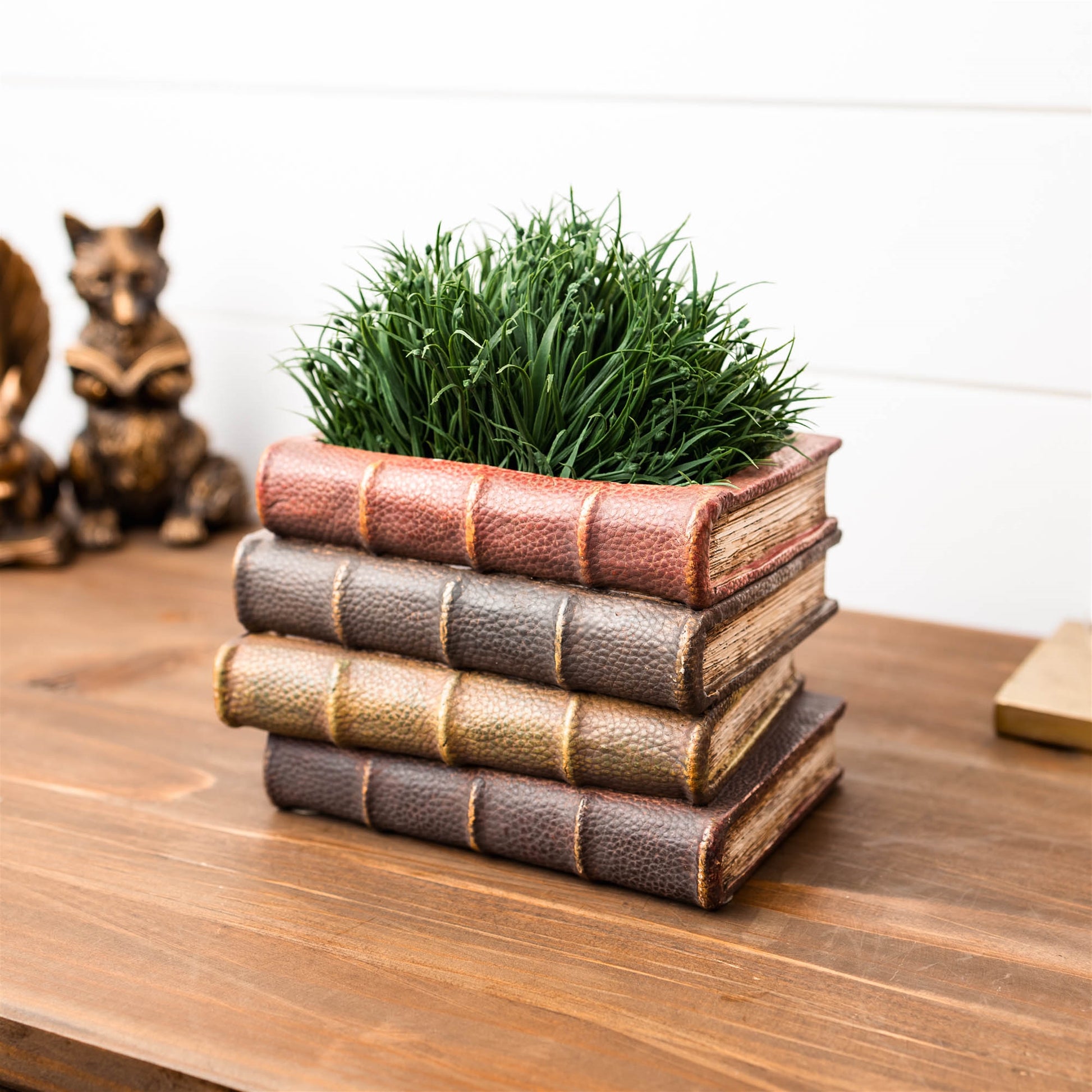 Decorative book stack vase with vintage hardcover book design, textured covers, and page details for cozy bookshelf decor