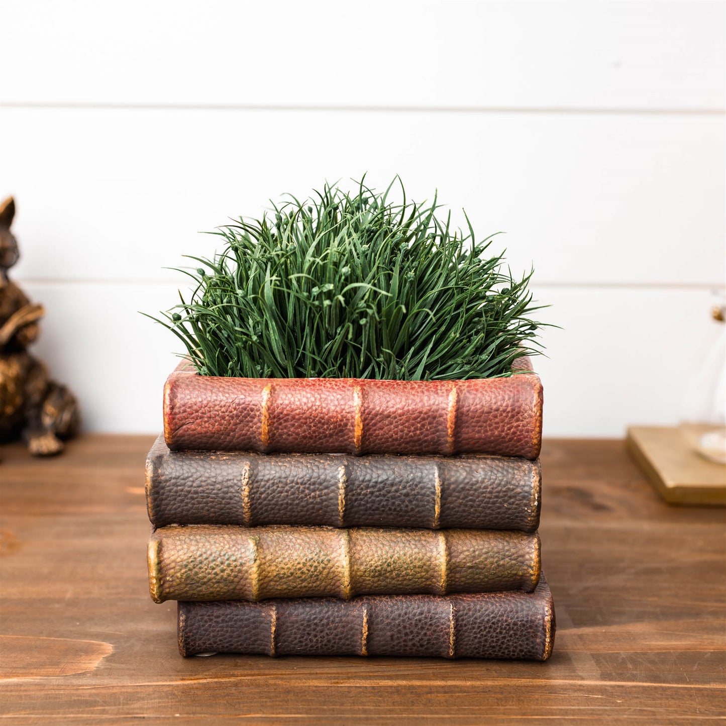 Decorative book stack vase with vintage hardcover book design, textured covers, and page details for cozy bookshelf decor