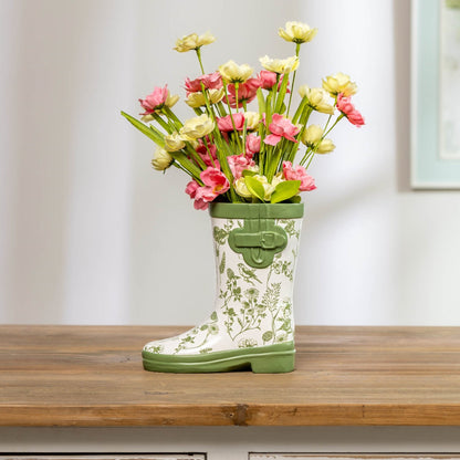 White rain boot vase with green botanical bird details and buckle accents, perfect for farmhouse decor and flowers