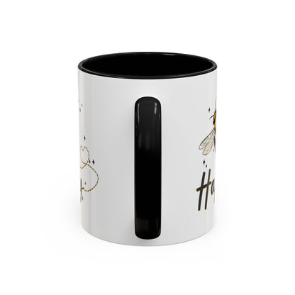 Bee Happy glazed ceramic mug with bee design, soft gold accents, and black handle and inside.