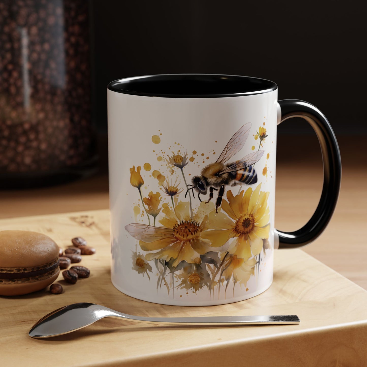 White ceramic mug with black handle and golden bee wildflower watercolor design