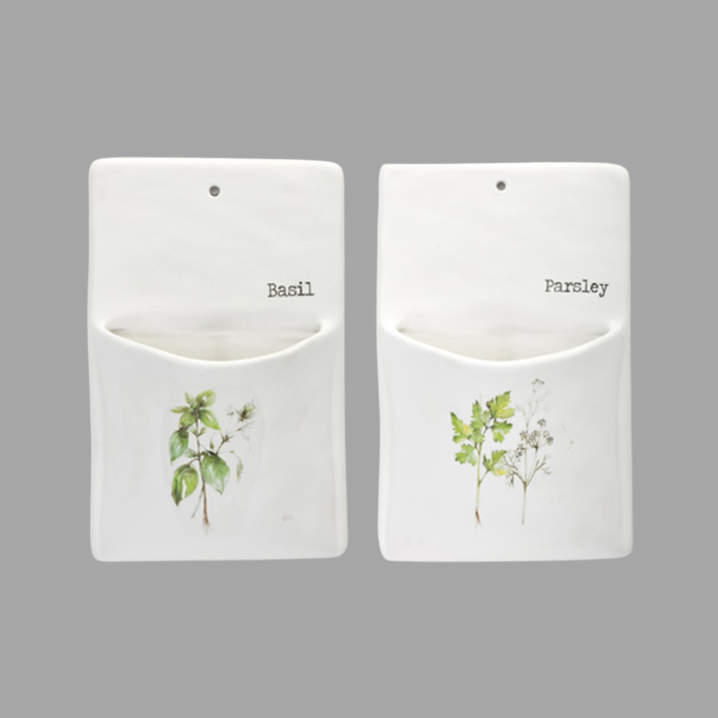 Two white pouches with plant illustrations and labels for basil and parsley on a gray background.