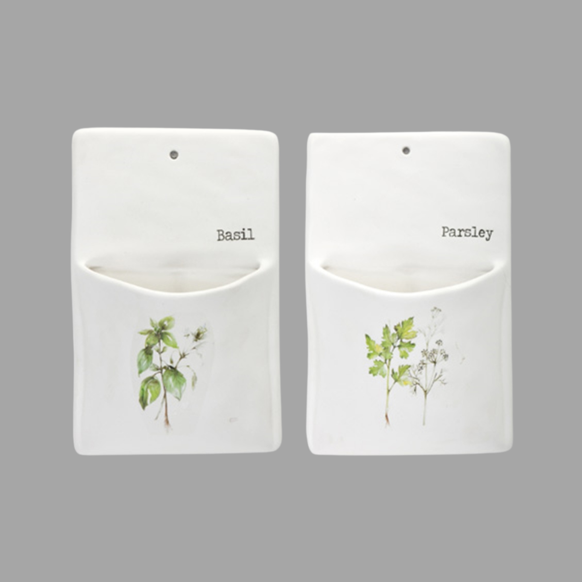 Two white pouches with plant illustrations and labels for basil and parsley on a gray background.