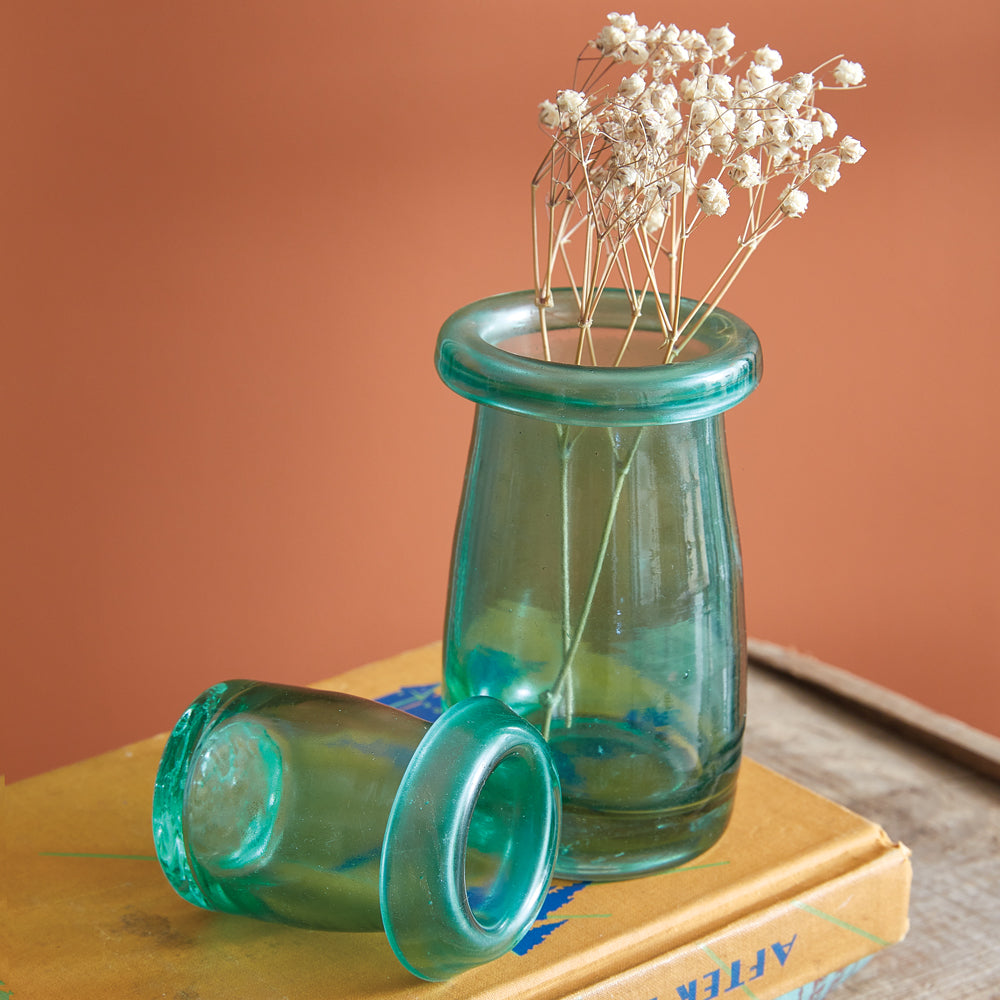 Two mushroom-shaped glass bud vases, handcrafted and mouth-blown, showcasing elegant, organic designs with unique variations. View 2