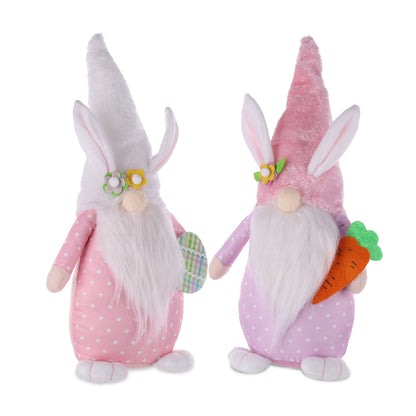 Two plush Easter bunny gnomes in pastel pink and purple with bunny ears, sitting on a shelf, adding whimsy to spring decor.