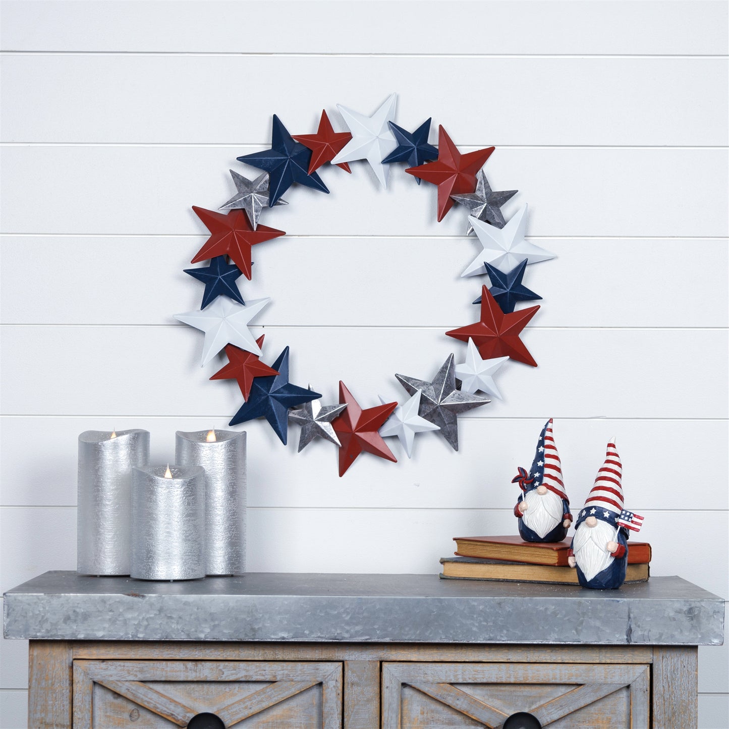 Americana Metal Star Wreath with bold red, white, and blue stars, crafted from durable metal, hanging on a rustic wooden door.