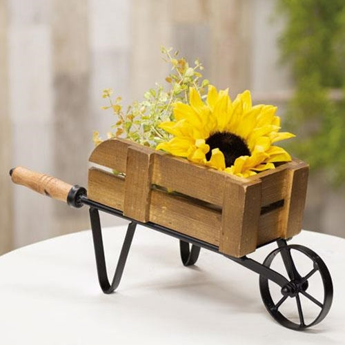Distressed Garden Wheelbarrow with realistic metal and wood details, perfect for displaying dolls or potted flowers in a garden.