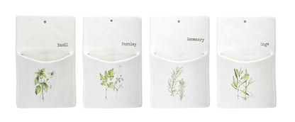 Four white pouches with herb illustrations and labels on a white background