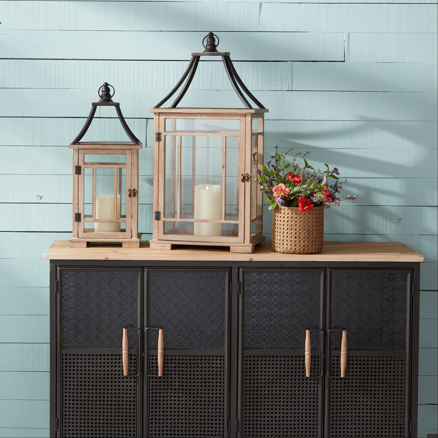 Rustic wooden lantern set with metal lids, showcasing farmhouse charm for cozy, vintage-inspired decor.