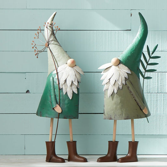 Two vibrant teal iron garden gnomes with rustic metal finish, standing tall on a porch, adding whimsy and color to the space.