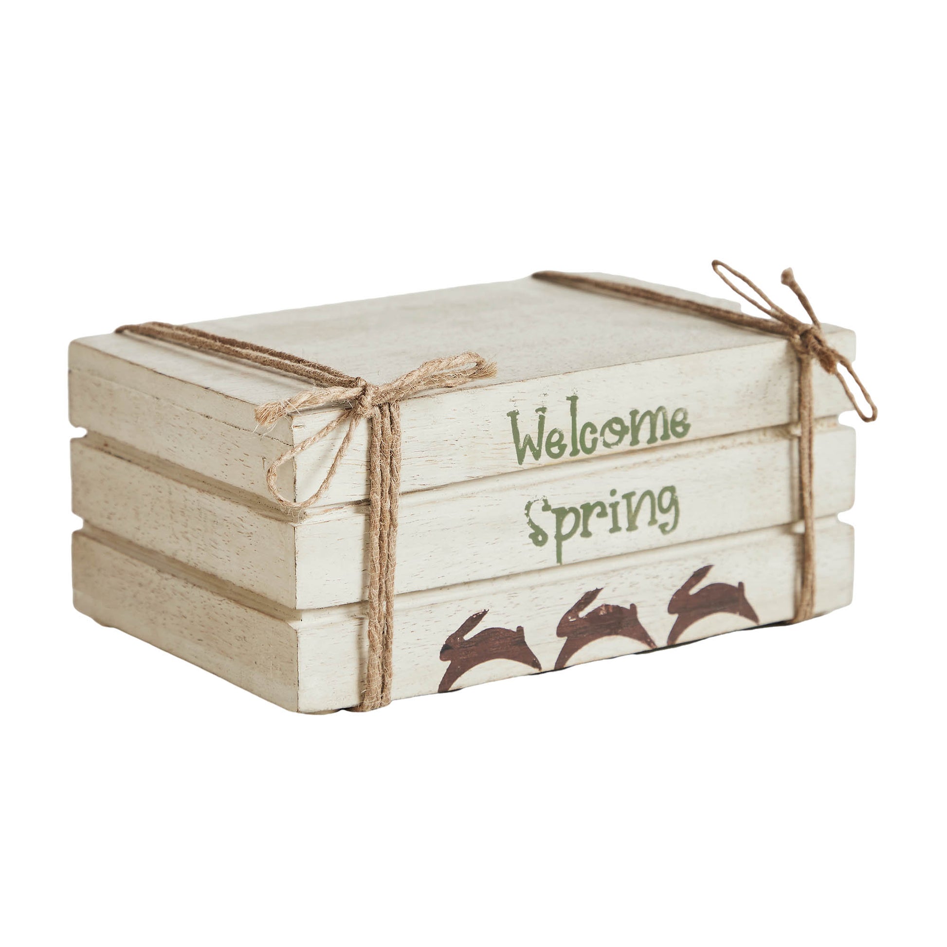 Cream faux book stack decor with Welcome Spring text, hand-painted bunnies, and soft farmhouse spring charm.