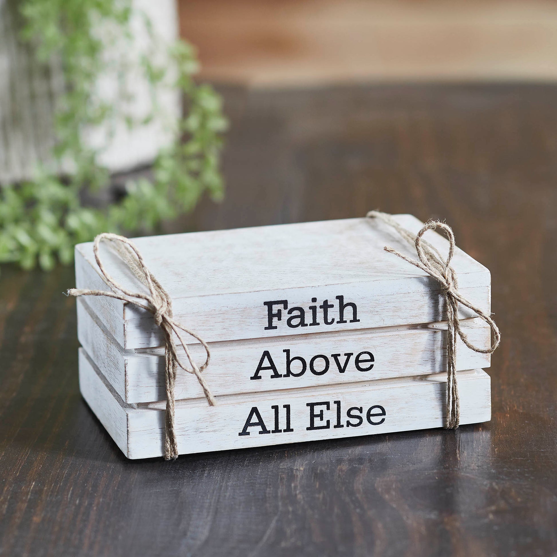 Rustic whitewashed faux book stack with “Faith Above All Else” text, perfect faith-inspired farmhouse decor.