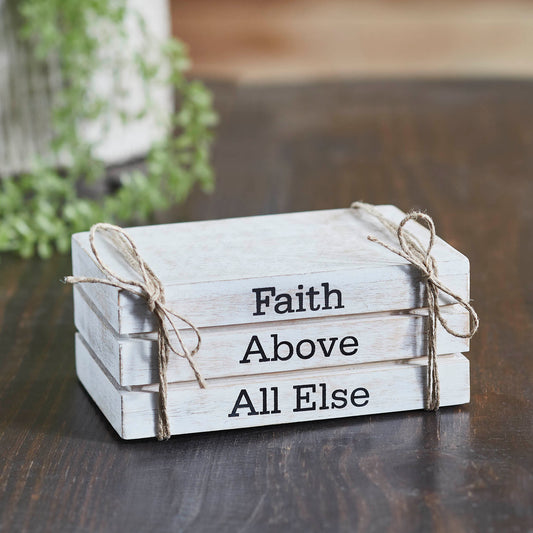Rustic whitewashed faux book stack with “Faith Above All Else” text, perfect faith-inspired farmhouse decor.