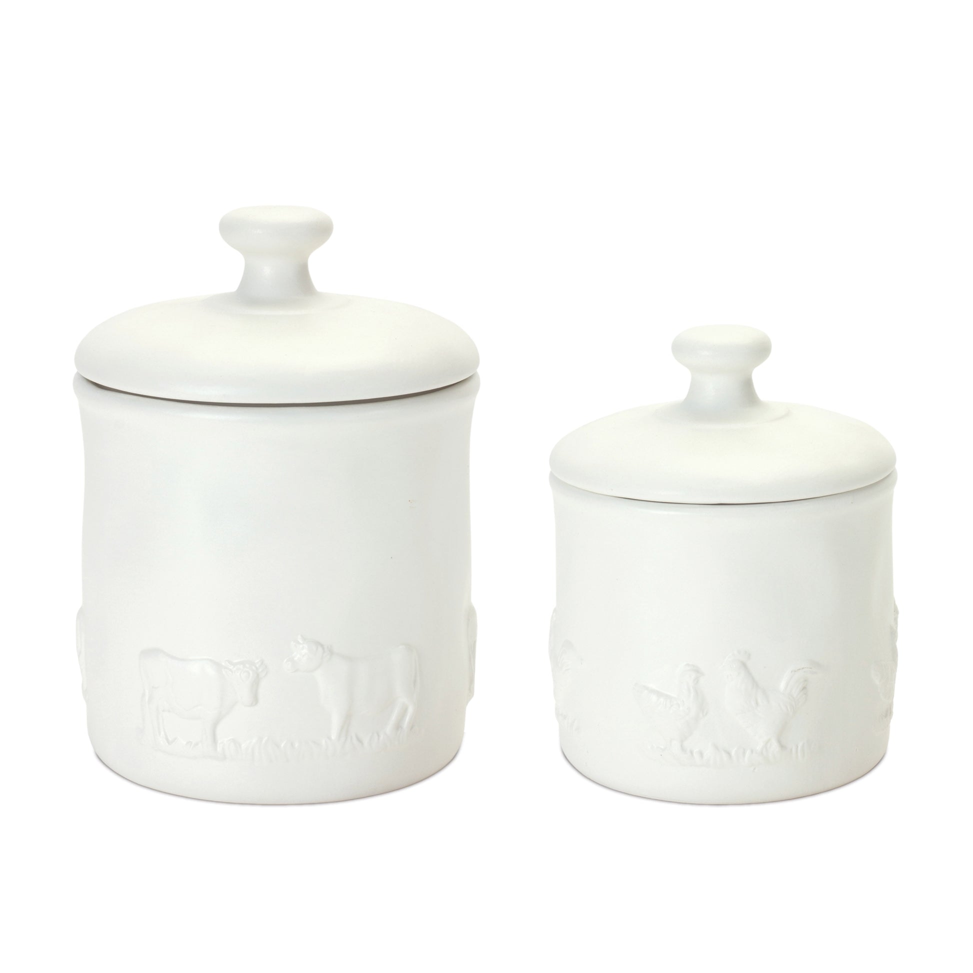 White ceramic canisters with farm animal accents, featuring chickens and cows, perfect for a farmhouse-style kitchen.