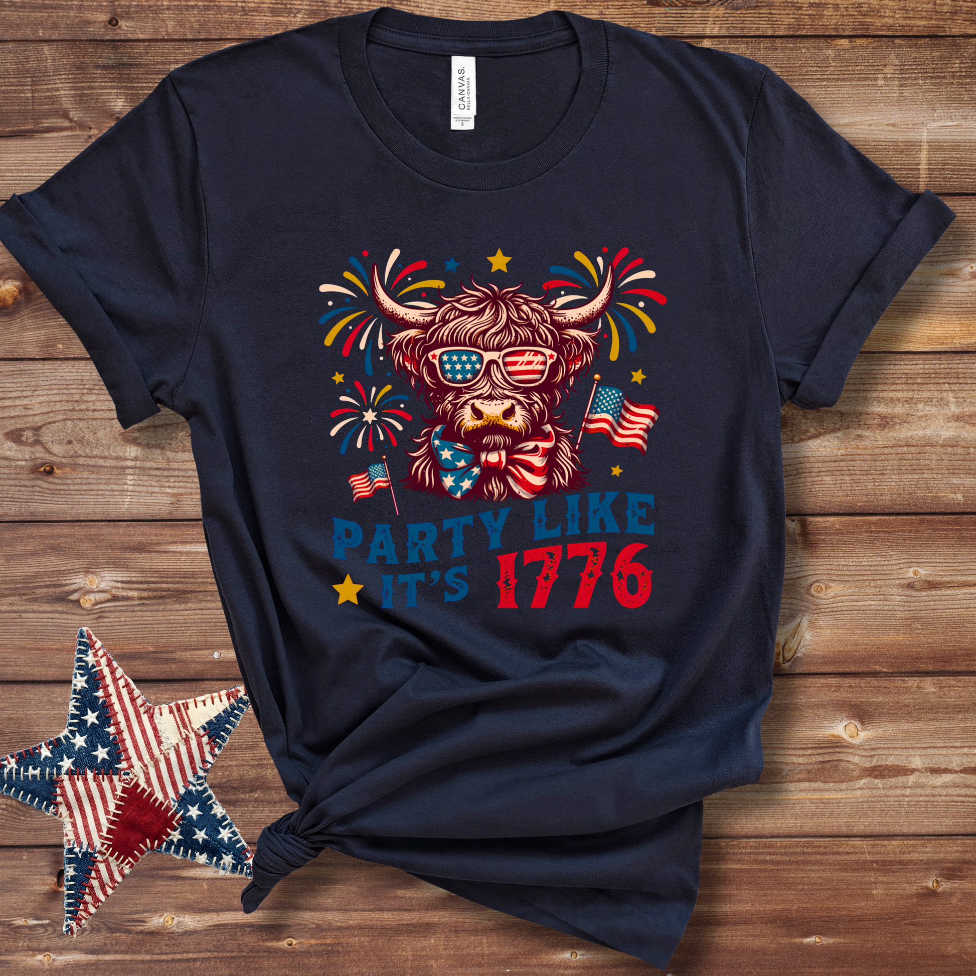 Navy Patriotic Highland cow graphic T-shirt with stars-and-stripes bandana in red, white, and blue for Fourth of July fun