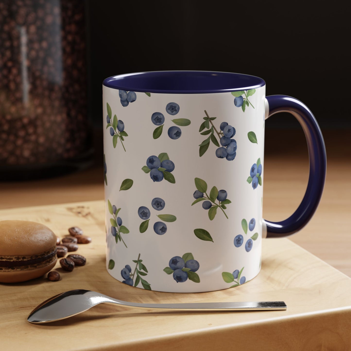 Ceramic mug with blueberry and vine pattern, white exterior, navy interior, and comfortable handle, perfect for farmhouse decor.