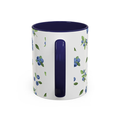 Ceramic mug with blueberry and vine pattern, white exterior, navy interior, and comfortable handle, perfect for farmhouse decor.