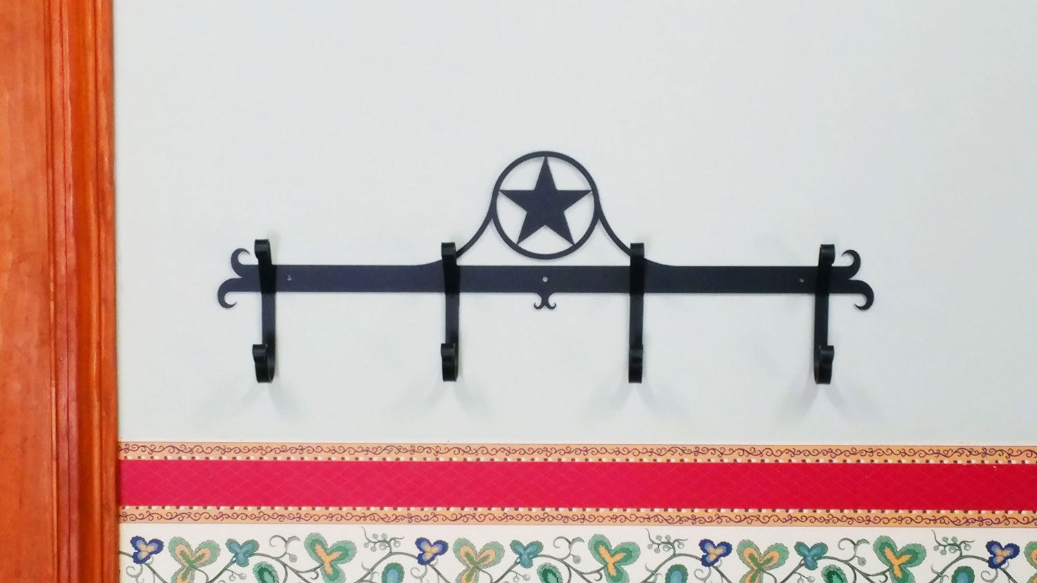Rustic Western Star Coat Bar with four hooks, featuring a charming design for enhancing farmhouse style in any home setting.