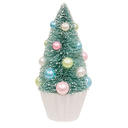 Teal bottle brush tree with faux snow, pastel pearl baubles in blue, pink, green, white on a pleated white base.