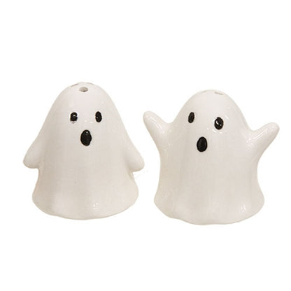White ceramic ghost salt and pepper shakers with black eyes, a cute spooky Halloween kitchen accent