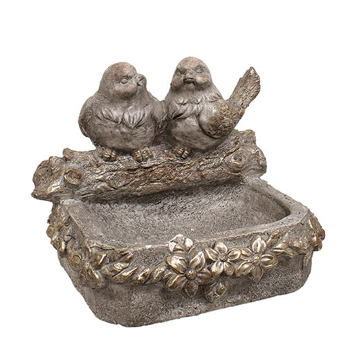 Distressed stone-look bird feeder with floral accents, featuring two carved birds on a log, in dimensional gray tones.