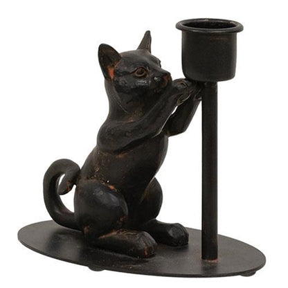 Black iron taper candle holder with a playful sitting cat figurine, perfect for adding whimsy to tabletops or mantles.