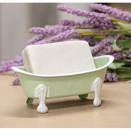 Mint green soap dish with white rim and legs, vintage bathtub design, featuring drainage holes for soap and sponges.