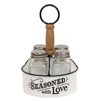 Rustic white metal seasoning caddy with wood handle and four glass shakers, featuring “seasoned with love” lettering