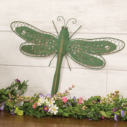 Distressed green-copper metal dragonfly wall accent with ornate cutout wings and rustic farmhouse charm