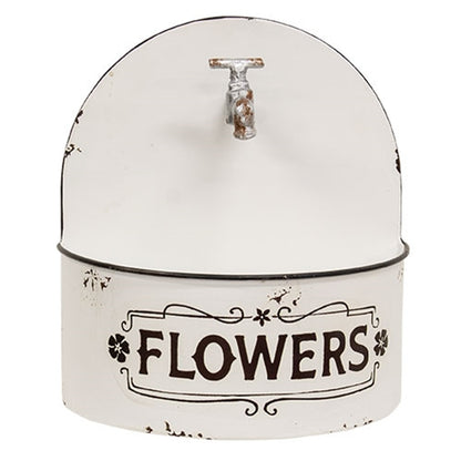 Distressed white farmhouse wall planter with arched top, rusty faux spicket, black rim, and vintage floral detailing.