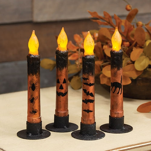 Grungy Halloween flameless taper candles in orange and black with bats, jack-o-lantern, spiders, and cat designs
