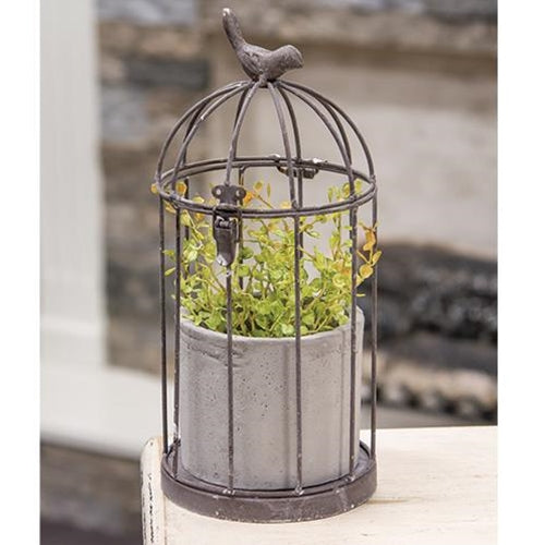 White-washed metal birdcage with a hinged top, hook closure, and small metal bird, includes a removable cement pot for florals.
