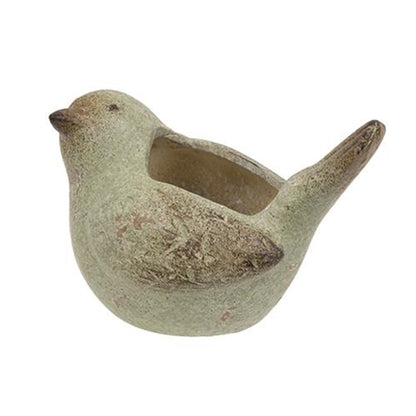 Distressed bird-shaped planter in antiquated brown and green resin, ideal for small plants, adds vintage charm to any room.