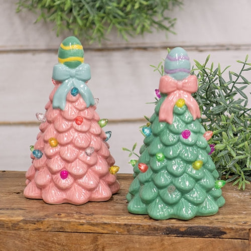Two ceramic Easter egg LED table trees with textured leaves, pastel bulb lights, one in sage green and the other in medium pink.