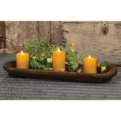 Oval-shaped carved wood bread bowl with a roughhewn texture and dark brown finish, adding rustic charm to home décor.