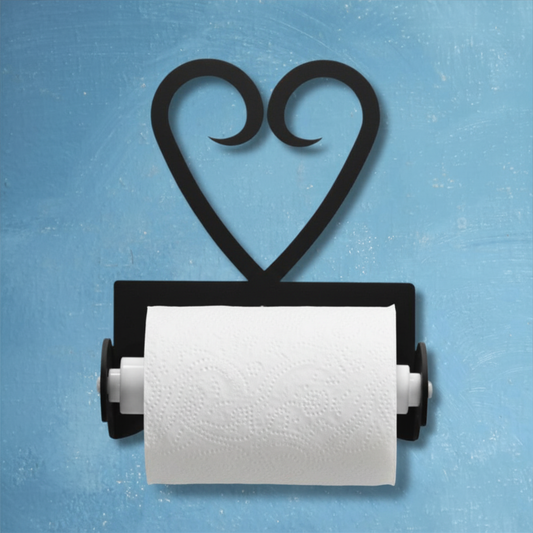 Black heart-shaped paper towel holder with a roll of white paper towels on a blue background