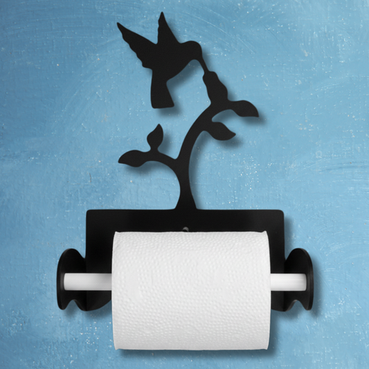 Black metal paper towel holder with bird design on a blue background
