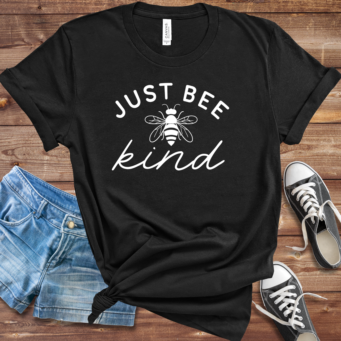 Rustic Just Bee Kind tee with sweet bee graphic and uplifting message in cozy farmhouse-inspired style.