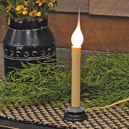 Four clear silicone-coated lightbulbs with candelabra silver screw bases and dipped peak tops, perfect for electric candles.