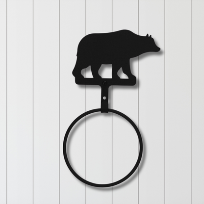 Towel ring with bear silhouette on a white wooden background